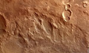 Это самый большой "кратер" в Солнечной системе расположен на Марсе.